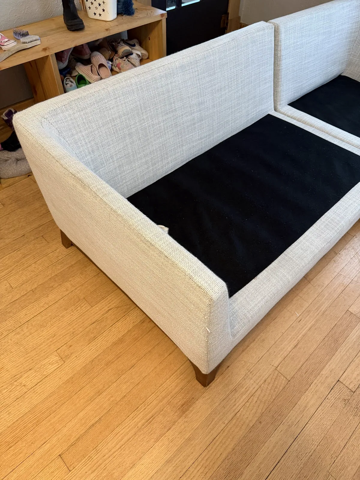 Upholstery cleaning of a cream sofa in progress